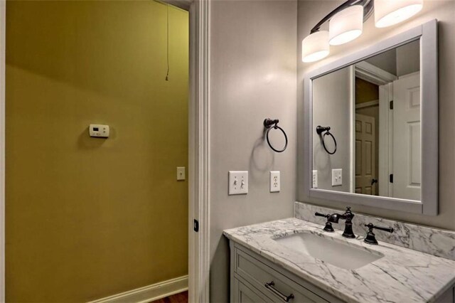 521 Crabapple Rd, Clarkesville, GA 30523 - bathroom featuring vanity, baseboards, and wood finished floors