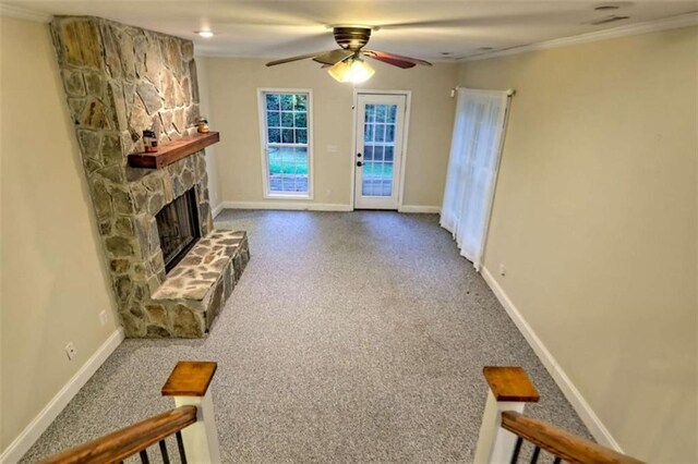 521 Crabapple Rd, Clarkesville, GA 30523 - unfurnished living room with carpet flooring, baseboards, a ceiling fan, a fireplace, and ornamental molding