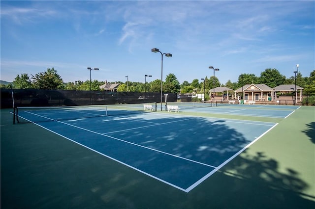 view of sport court featuring fence