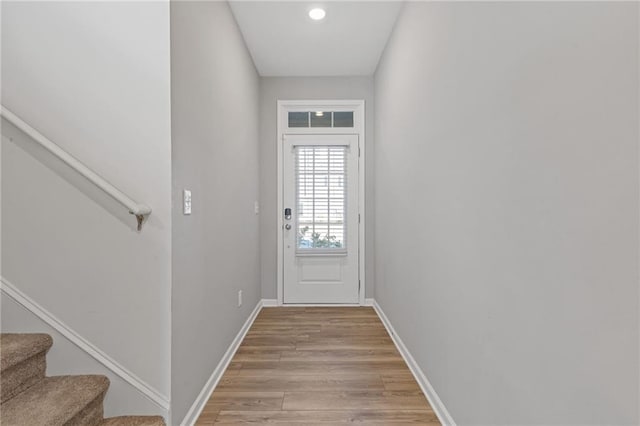 doorway to outside with light wood-type flooring