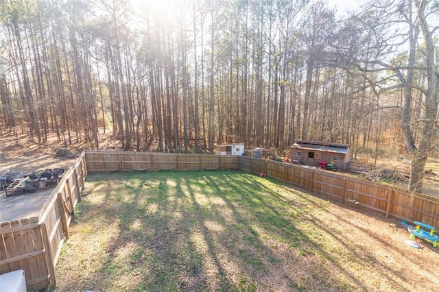 view of yard with a fenced backyard