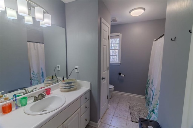 bathroom with tile patterned floors, toilet, and vanity