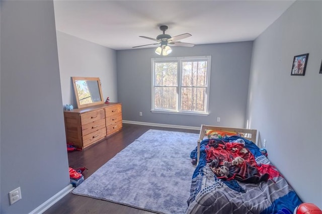 bedroom with dark wood-type flooring and ceiling fan