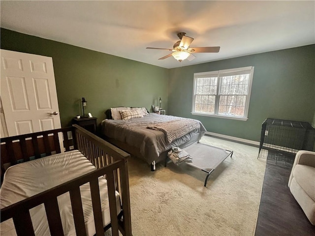 bedroom featuring carpet floors, ceiling fan, and baseboards