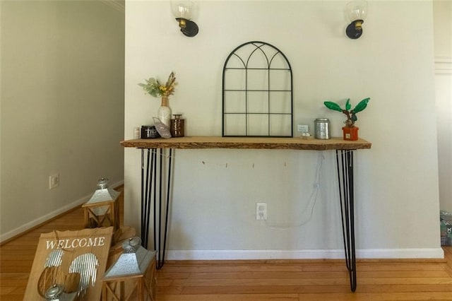 bar with light hardwood / wood-style flooring