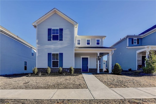 333 Golden Eagle Pkwy, Braselton, GA 30517 - traditional home featuring brick siding and a porch