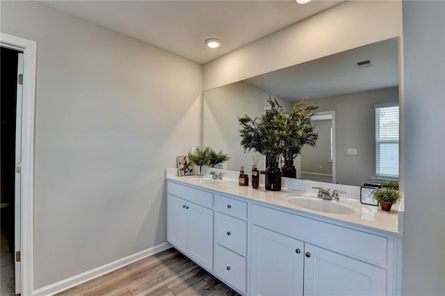 333 Golden Eagle Pkwy, Braselton, GA 30517 - bathroom with double vanity, wood finished floors, and baseboards