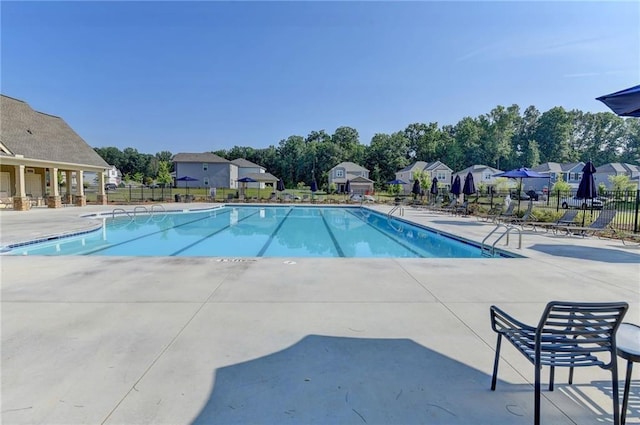 333 Golden Eagle Pkwy, Braselton, GA 30517 - community pool with a patio, view of wooded area, and a residential view