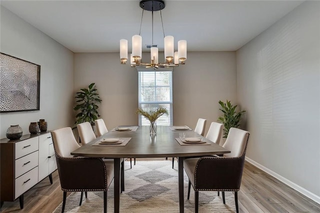 333 Golden Eagle Pkwy, Braselton, GA 30517 - dining area with a chandelier, light wood-style flooring, and baseboards