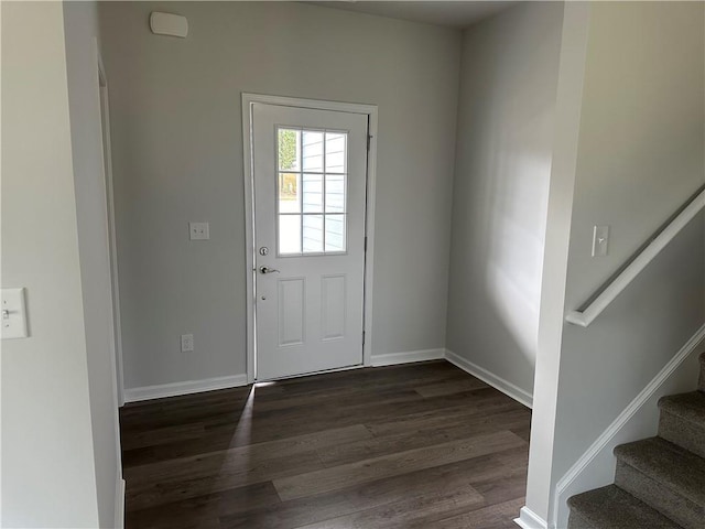 entryway with dark hardwood / wood-style flooring