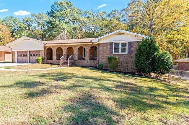 ranch-style home with a porch, a garage, and a front lawn