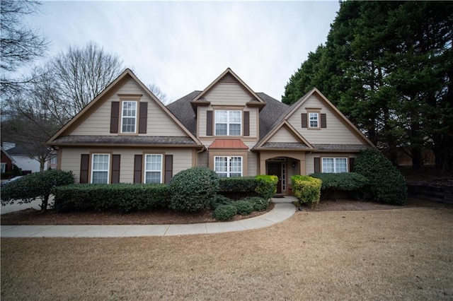 craftsman house with roof with shingles