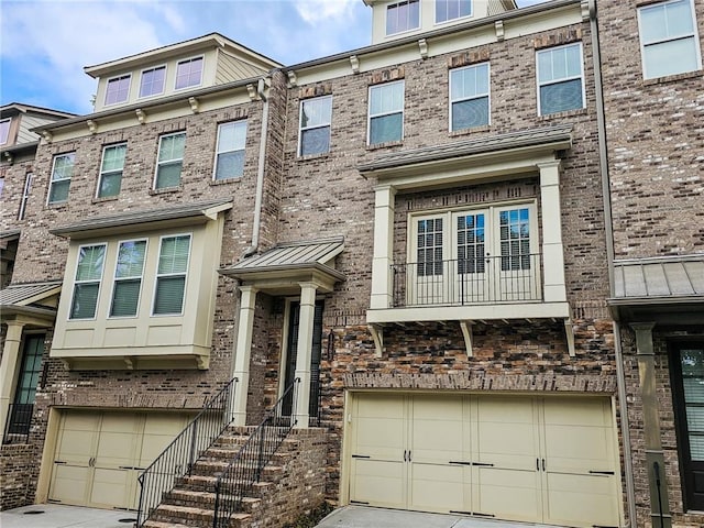 1263 Linden Ct NE, Atlanta, GA 30329 - multi unit property featuring a garage, driveway, and brick siding