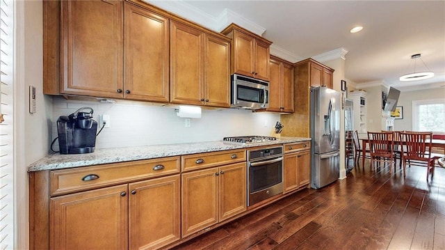 1263 Linden Ct NE, Atlanta, GA 30329 - kitchen featuring brown cabinets, crown molding, light stone countertops, appliances with stainless steel finishes, and dark wood-type flooring