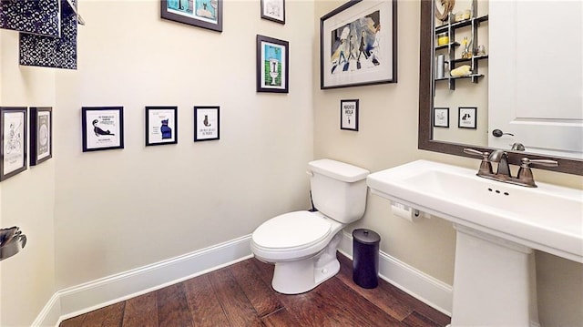 1263 Linden Ct NE, Atlanta, GA 30329 - bathroom with baseboards, toilet, and hardwood / wood-style flooring