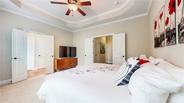 1263 Linden Ct NE, Atlanta, GA 30329 - bedroom featuring a ceiling fan, light colored carpet, a raised ceiling, baseboards, and ornamental molding
