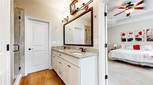 1263 Linden Ct NE, Atlanta, GA 30329 - bathroom with double vanity, a ceiling fan, tiled shower, and a sink