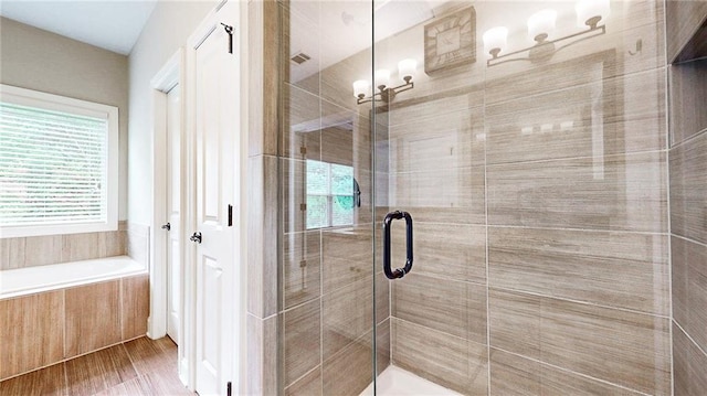 1263 Linden Ct NE, Atlanta, GA 30329 - bathroom featuring visible vents, a shower stall, wood finished floors, and a bath