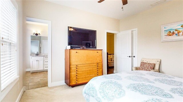 1263 Linden Ct NE, Atlanta, GA 30329 - bedroom with baseboards, a ceiling fan, connected bathroom, and light carpet