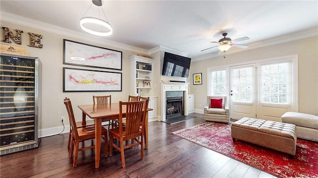 1263 Linden Ct NE, Atlanta, GA 30329 - dining area featuring wine cooler, crown molding, a ceiling fan, and dark wood finished floors