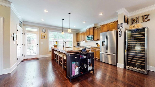 1263 Linden Ct NE, Atlanta, GA 30329 - kitchen with wine cooler, a kitchen bar, brown cabinets, a sink, and appliances with stainless steel finishes