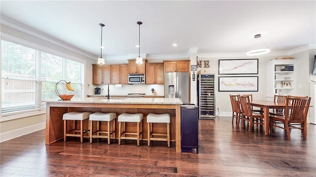 1263 Linden Ct NE, Atlanta, GA 30329 - kitchen with baseboards, appliances with stainless steel finishes, ornamental molding, and wine cooler