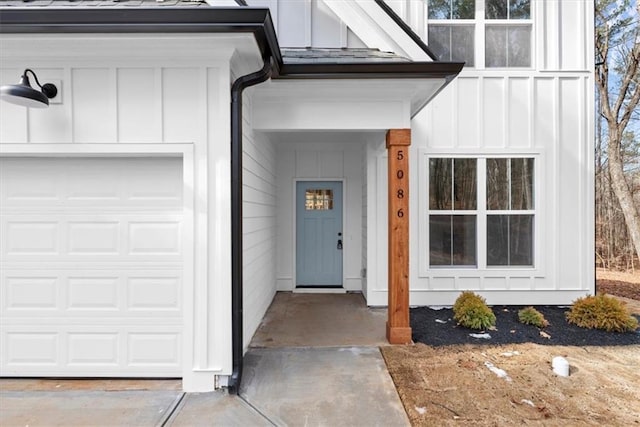 doorway to property featuring a garage