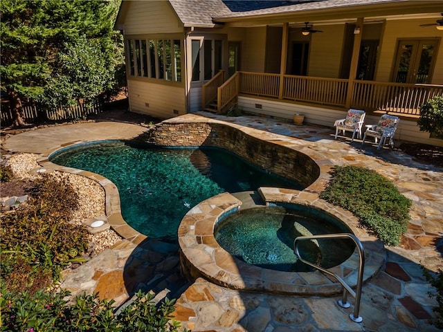 view of pool with ceiling fan, an in ground hot tub, and a patio