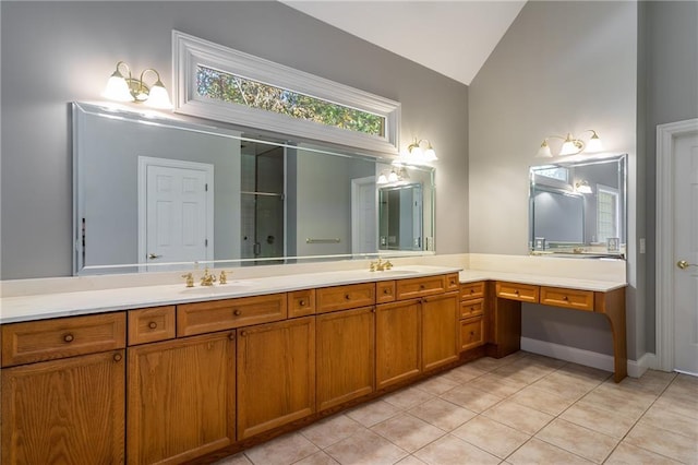 bathroom with vanity, a shower with door, vaulted ceiling, and tile patterned floors