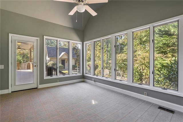 unfurnished sunroom with lofted ceiling and ceiling fan