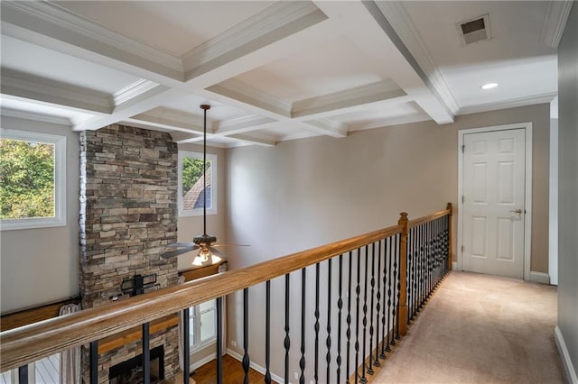 hallway with crown molding, coffered ceiling, beam ceiling, and carpet flooring