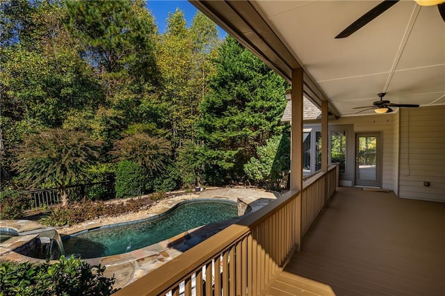 wooden terrace featuring ceiling fan