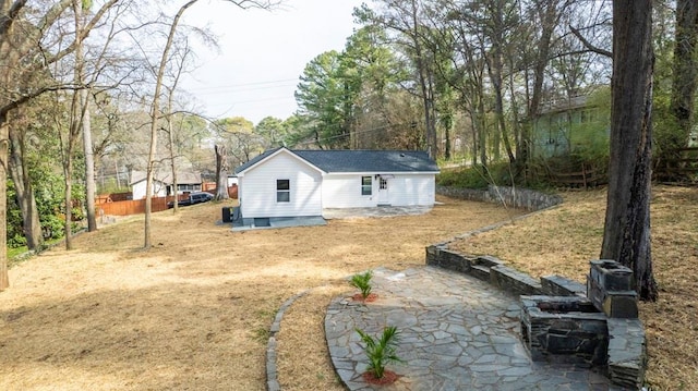 rear view of property featuring driveway