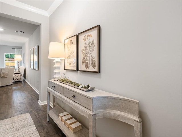 corridor with dark hardwood / wood-style flooring