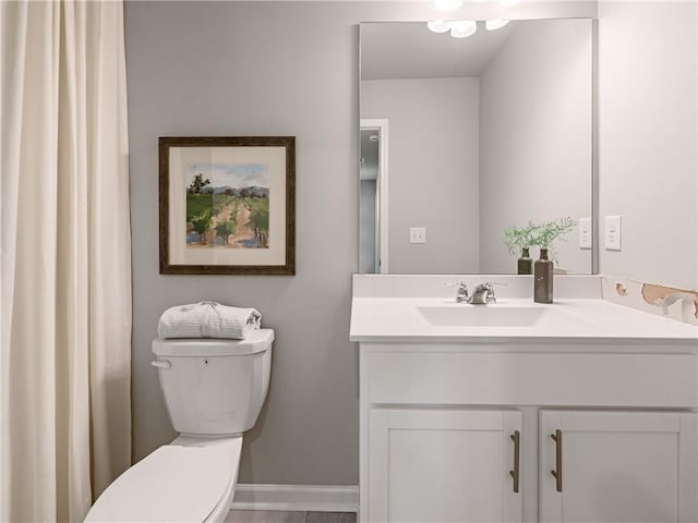 bathroom with vanity and toilet