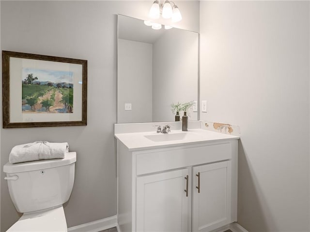 bathroom featuring toilet and vanity