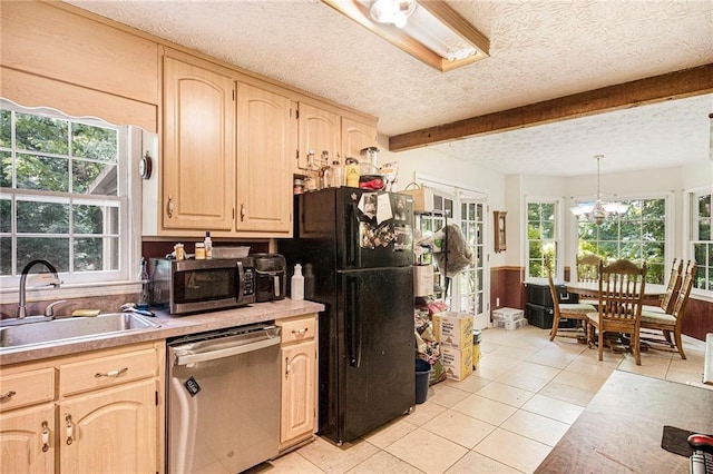 kitchen with light brown cabinetry, sink, decorative light fixtures, light tile patterned floors, and appliances with stainless steel finishes