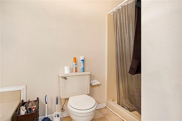 bathroom with a shower with curtain, tile patterned floors, and toilet