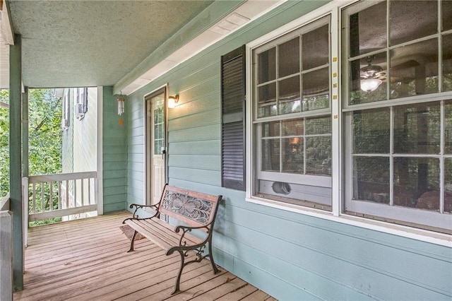 wooden terrace featuring covered porch