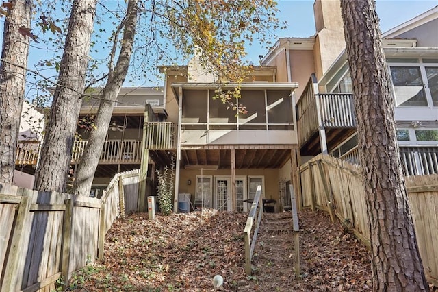 back of property featuring a sunroom