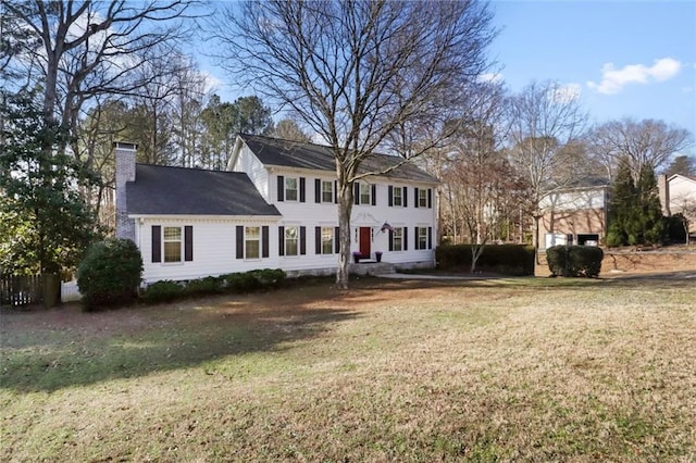 rear view of property featuring a yard