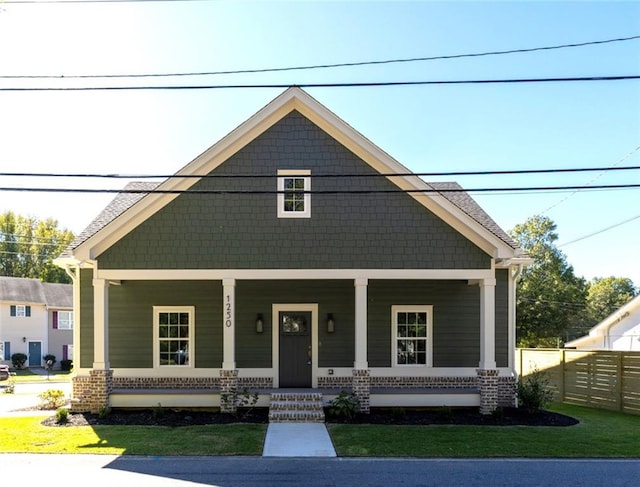 view of front of home featuring covered porch