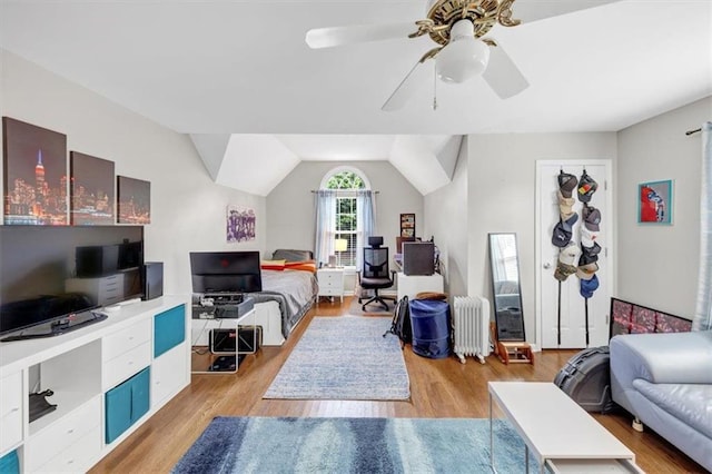 10400 Groomsbridge Rd, Alpharetta, GA 30022 - living room featuring radiator heating unit, light wood-style flooring, a ceiling fan, and a desk