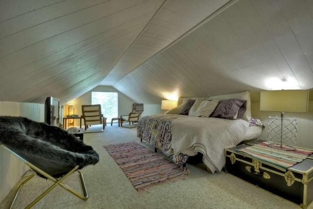 carpeted bedroom featuring vaulted ceiling