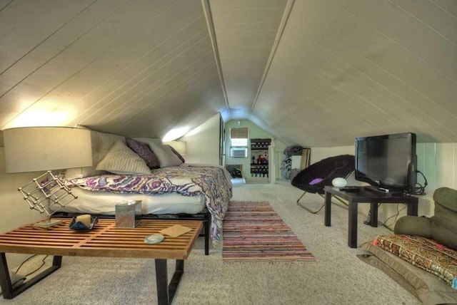 bedroom featuring carpet and lofted ceiling