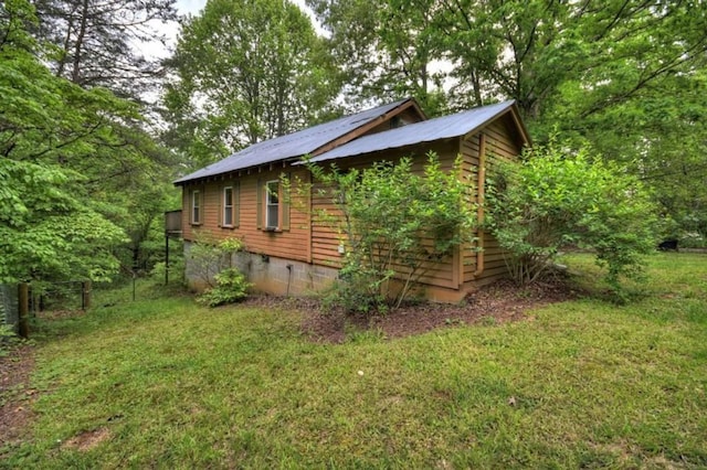 view of property exterior featuring a yard