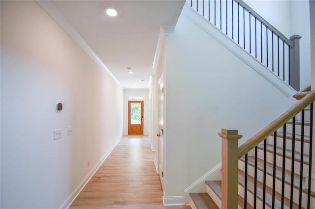5354 Shadow Walk Way, Gainesville, GA 30507 - corridor with light wood-type flooring, stairway, baseboards, recessed lighting, and crown molding