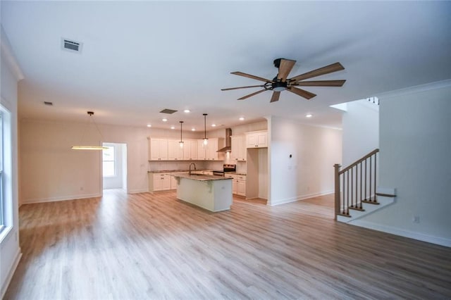 5354 Shadow Walk Way, Gainesville, GA 30507 - unfurnished living room with a sink, light wood-style flooring, a ceiling fan, baseboards, and recessed lighting
