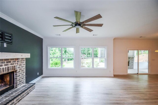 5354 Shadow Walk Way, Gainesville, GA 30507 - unfurnished living room with wood finished floors, a brick fireplace, crown molding, baseboards, and ceiling fan