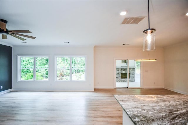 5354 Shadow Walk Way, Gainesville, GA 30507 - spare room featuring light wood finished floors, baseboards, ornamental molding, and a ceiling fan